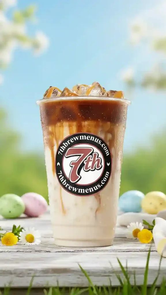 Clear cup of a refreshing iced Caramel Macchiato specialty drink from the 7 Brew menu.